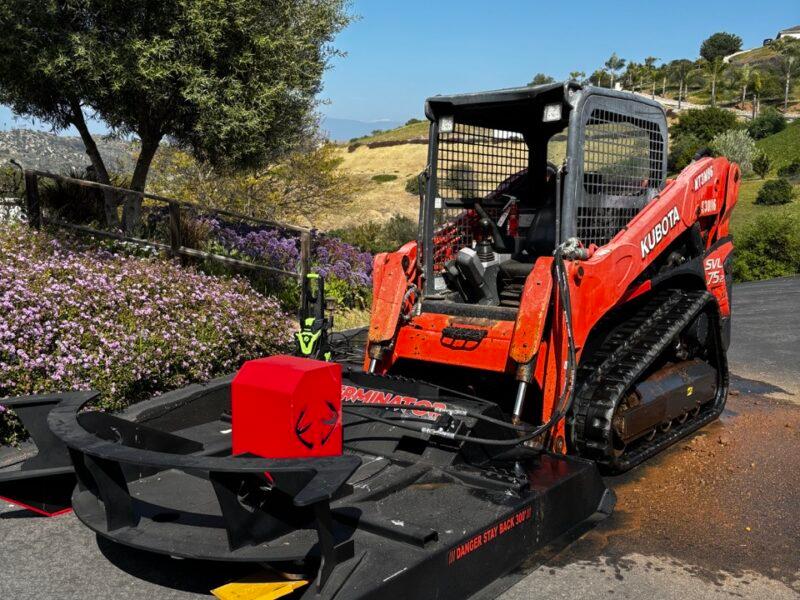 Brush clearing with track loader
